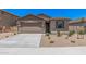Charming single-story home featuring a low maintenance yard and a two-car garage at 18374 W Poston Dr, Surprise, AZ 85387