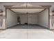 Spacious garage with high ceilings, water heater, and plenty of room for parking and storage at 18374 W Poston Dr, Surprise, AZ 85387