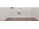 A laundry room featuring tiled floors with hookups and electrical outlets at 18374 W Poston Dr, Surprise, AZ 85387