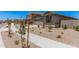 Street view of single-story homes with low maintenance yards, concrete driveway, and neutral tones at 18374 W Poston Dr, Surprise, AZ 85387