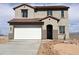 Charming two-story home featuring a two-car garage, tile roof, and neutral-toned stucco exterior at 20756 N 224Th Ave, Surprise, AZ 85387