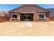 Back exterior of home featuring a large dirt yard and covered patio at 21845 E Bonanza Ct, Queen Creek, AZ 85142