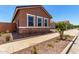 Well-maintained home featuring desert landscaping and a sidewalk leading to the front at 21845 E Bonanza Ct, Queen Creek, AZ 85142