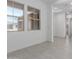 Inviting interior space with light tile flooring, natural light, and neutral tones, providing a versatile area for various uses at 21845 E Bonanza Ct, Queen Creek, AZ 85142