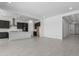 Spacious open-concept living area with light tile floors, recessed lighting, and easy access to the kitchen at 21845 E Bonanza Ct, Queen Creek, AZ 85142