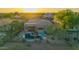 Aerial view of a single-Gathering home with a private backyard, pebble tec pool, covered patio, desert landscaping and comfortable lounge chairs at 22847 N 53Rd E St, Phoenix, AZ 85054