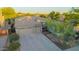 Single-Gathering home with a desert landscape, pebble tec pool, and a three-car garage at 22847 N 53Rd E St, Phoenix, AZ 85054