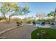 Lush backyard featuring desert landscaping, pool with waterfall, and comfortable seating at 22847 N 53Rd E St, Phoenix, AZ 85054