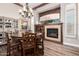 Elegant dining room with a fireplace and a wooden dining table, complete with stylish furnishings and decor at 22847 N 53Rd E St, Phoenix, AZ 85054