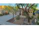Single-Gathering home featuring a desert landscape, a three-car garage, and a covered porch at 22847 N 53Rd E St, Phoenix, AZ 85054