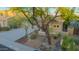 Single-Gathering home featuring a desert landscape, a three-car garage, and a covered porch at 22847 N 53Rd E St, Phoenix, AZ 85054