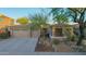 Charming single-Gathering home featuring a well-manicured desert landscape, a three-car garage and a covered porch at 22847 N 53Rd E St, Phoenix, AZ 85054