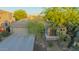 Charming single-Gathering home featuring a well-manicured desert landscape, a three-car garage and a covered porch at 22847 N 53Rd E St, Phoenix, AZ 85054