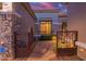 Inviting home featuring a gated courtyard, stone accents, and a beautifully lit front entry at 22847 N 53Rd E St, Phoenix, AZ 85054