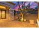 Elegant gated entrance featuring stone column, providing access to a charming home's courtyard at 22847 N 53Rd E St, Phoenix, AZ 85054