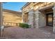 Exterior of a single-story house showing stone accents, pavers and well maintained landscaping at 22847 N 53Rd E St, Phoenix, AZ 85054