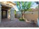 Exterior of home showing stone column, decorative iron door and well maintained landscaping at 22847 N 53Rd E St, Phoenix, AZ 85054
