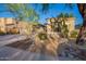 Charming home showcasing desert landscaping, stone facade accents, and a spacious driveway at 22847 N 53Rd E St, Phoenix, AZ 85054