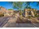 Charming home featuring a desert landscaped front yard, stone accents, and a spacious three-car garage at 22847 N 53Rd E St, Phoenix, AZ 85054