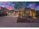 Charming home featuring a desert landscaped front yard, stone accents, and a spacious three-car garage at 22847 N 53Rd E St, Phoenix, AZ 85054