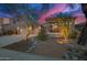 Charming home showcasing desert landscaping, stone facade accents, and a spacious driveway at 22847 N 53Rd E St, Phoenix, AZ 85054