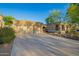 Attractive home featuring stone accents on the facade, desert landscaping, and a spacious three-car garage at 22847 N 53Rd E St, Phoenix, AZ 85054