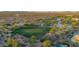Bird's eye view of a desert golf course next to houses and desert landscaping at 22847 N 53Rd E St, Phoenix, AZ 85054