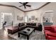 Inviting living room with hardwood floors, large sectional sofa and open concept at 22847 N 53Rd E St, Phoenix, AZ 85054