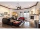 Bright living room featuring hardwood floors, a fireplace and comfortable seating arrangement at 22847 N 53Rd E St, Phoenix, AZ 85054