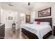 Relaxing main bedroom featuring hardwood floors and an ensuite bathroom at 22847 N 53Rd E St, Phoenix, AZ 85054