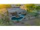 A picturesque outdoor pool area with lush landscaping and patio furniture, perfect for relaxation at 22847 N 53Rd E St, Phoenix, AZ 85054