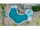Aerial view of a uniquely shaped pool with pebble-tec accents and desert-style landscaping at 22847 N 53Rd E St, Phoenix, AZ 85054