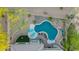 Relaxing backyard pool with lounge chairs, custom rock features, and desert landscaping from above at 22847 N 53Rd E St, Phoenix, AZ 85054