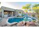 Beautiful backyard pool featuring desert landscaping, an outdoor kitchen and patio area, perfect for relaxation and entertaining guests at 22847 N 53Rd E St, Phoenix, AZ 85054