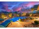 Beautiful backyard pool with rock waterfall, desert landscaping, and lounge chairs at 22847 N 53Rd E St, Phoenix, AZ 85054
