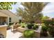 Spacious backyard with built-in seating and lush desert landscaping at 24226 N 22Nd St, Phoenix, AZ 85024