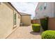 Low maintenance backyard with gravel, neat landscaping, and privacy wall at 24226 N 22Nd St, Phoenix, AZ 85024