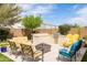 Backyard with seating, built in BBQ, fire pit, and lush landscaping at 24226 N 22Nd St, Phoenix, AZ 85024