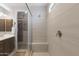 Bathroom with walk-in shower, tiled walls, and a built-in bench at 24226 N 22Nd St, Phoenix, AZ 85024