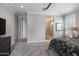 Bedroom featuring a large window, ensuite bathroom, and neutral color palette at 24226 N 22Nd St, Phoenix, AZ 85024