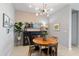 Inviting dining area with stylish lighting, dark accent cabinet, and charming decor at 24226 N 22Nd St, Phoenix, AZ 85024