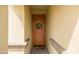 Inviting front entrance with a lovely wooden door, decorative wreath, and welcome mat at 24226 N 22Nd St, Phoenix, AZ 85024