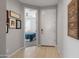Hallway leading to a bedroom, featuring a white door and decor at 24226 N 22Nd St, Phoenix, AZ 85024