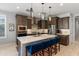 Modern kitchen featuring an island with seating, stainless steel appliances, and ample cabinet space at 24226 N 22Nd St, Phoenix, AZ 85024