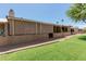Back porch with shade screening and landscaped backyard with gravel at 25230 S Berry Brook Dr, Sun Lakes, AZ 85248