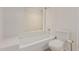 Bathroom with white tiled shower-tub combination at 25230 S Berry Brook Dr, Sun Lakes, AZ 85248
