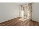 Cozy bedroom with wood-look flooring and sliding glass doors to the patio at 25230 S Berry Brook Dr, Sun Lakes, AZ 85248
