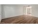 Bright bedroom featuring sleek wood floors and a mirrored closet at 25230 S Berry Brook Dr, Sun Lakes, AZ 85248