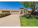 Charming home featuring a tile roof, desert landscaping, and inviting entryway at 25230 S Berry Brook Dr, Sun Lakes, AZ 85248