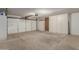 Spacious garage with ample storage cabinets and a secure, automatic door at 25230 S Berry Brook Dr, Sun Lakes, AZ 85248
